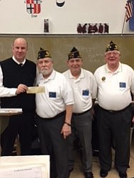 Members of the Austintown American Legion Post 302 recently made a donation of $500 to the Austintown Fitch band for its upcoming trip to Washington, D.C. The band was selected to perform in the National Cherry Blossom Parade that will take place April 14. During the trip, the band also will play a concert at the World War II Memorial and lay a wreath at the Vietnam Wall in honor of three Fitch alumni who died in action. Above, from left, are Wesley O’Connor, band director; Sam Swogger, American Legion commander; Harold Swogger; and Gale Reedy.