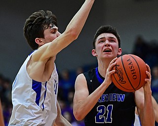 POLAND, OHIO - JANUARY 26, 2018: Lakeview's Jeff Remmick, right, goes to the basket against Poland's Daniel Kramer during the second half of their game on Friday night at Poland High School. DAVID DERMER | THE VINDICATOR