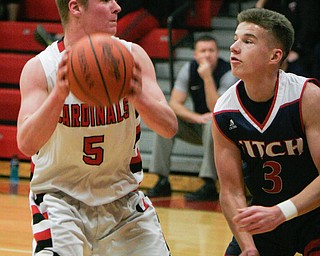 William D. Lewis the Vindicator   Canfield's CTyler Dobrindt(5) passes around Fitch's Blake Baker(3) during 1-26-18 action at Canfield.