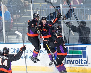 Scott R. Galvin | The Vindicator.Youngstown Phantoms center Mike Regush (21) and defenseman Michael Joyaux (62) congratulate center Matthew Barry (26) on his third period goal against the Dubuque Fighting Saints at the Covelli Centre on January 27, 2018. The Phantoms won 6-5 in overtime.