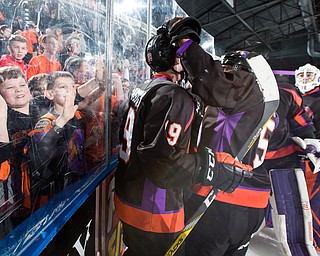 Scott R. Galvin | The Vindicator.The Youngstown Phantoms and fans celebrate Chase Gresock's (19) overtime goal against the Dubuque Fighting Saints at the Covelli Centre on January 27, 2018.