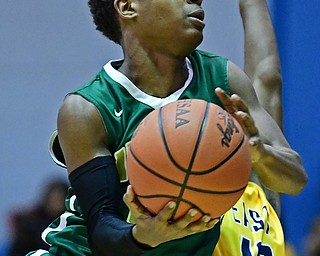 YOUNGSTOWN, OHIO - JANUARY 27, 2018: Ursuline's Brajon Nuby goes to the basket against East's Tyrell Davis during the first half of their game on Friday night at East High School. DAVID DERMER | THE VINDICATOR