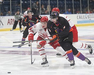 Youngstown Phantoms forward Tommy Parottino (9) pushes past Dubuque Fighting Saints defenseman Josh Maniscalco (24) in the first period of an USHL Hockey game, Sunday, Jan. 28, 2018, in Youngstown. Phantoms won 2-1...(Nikos Frazier | The Vindicator)