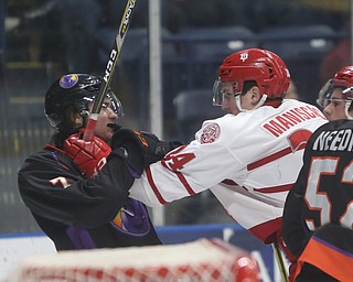 Dubuque Fighting Saints defenseman Josh Maniscalco (24) and Youngstown Phantoms left wing Eric Esposito (7) fight in the first period of an USHL Hockey game, Sunday, Jan. 28, 2018, in Youngstown. Phantoms won 2-1...(Nikos Frazier | The Vindicator)