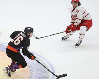 Youngstown Phantoms forward Matthew Barry (26) controls the puck as he skates against Dubuque Fighting Saints defenseman Jordan Wishman (6) in the first period of an USHL Hockey game, Sunday, Jan. 28, 2018, in Youngstown. Phantoms won 2-1...(Nikos Frazier | The Vindicator)