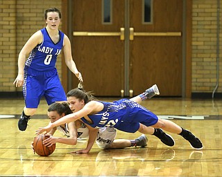 Jackson-Milton guard Michaelina Terranova (22) and McDonald's Olivia Perry (3) dive for the ball and in the first half of an Mahoning Valley Athletic Conference high school basketball game, Monday, Jan. 29, 2018, in McDonald. McDonald won 37-34...(Nikos Frazier | The Vindicator)