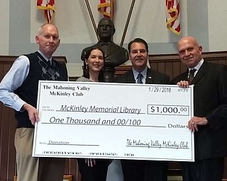 Mahoning Valley McKinley Club is in its 103rd year and celebrated with a banquet. Dr. Paul Kengor, a professor at Grove City College, was the speaker. The club donated $1,000 to the National McKinley Birthplace Memorial in Niles. Above, from left, are James Yuhasz, president of the McKinley Memorial board of directors; Sonia Kennedy, 2018 president of the McKinley Club; JD Williams, 2017 president of the club; and Matthew Blair, McKinley Memorial trustee.