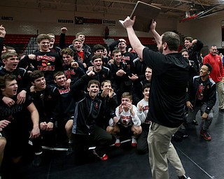 The Canfield wrestling team celebrates after defeating Louisville in the OHSAA Wrestling Division II Region 12 team finals, Wednesday, Jan. 31, 2018, in Canfield...(Nikos Frazier | The Vindicator)