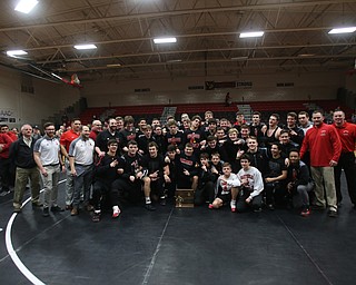 The Canfield wrestling team celebrates after defeating Louisville in the OHSAA Wrestling Division II Region 12 team finals, Wednesday, Jan. 31, 2018, in Canfield...(Nikos Frazier | The Vindicator)