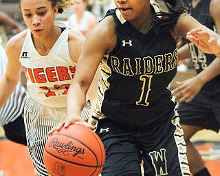 William D Lewis the Vindicator  Howland's Bryce Butler(22) pursues Harding'sBrayleonna woods(1) during 1-31-18 action at Howland.