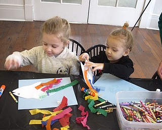 Neighbors | Zack Shively.The craft at the Baby Brilliant program at the Poland library offered children a chance to color and glue. They began with paper outline of a fish to color and decorate. They then glued the outline to a blue sheet of paper to resemble sea. Finally, they added stylish tissue paper to give the fish an interesting looking fin.