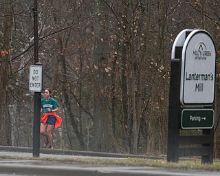 A woman runs past Laterman's Mill, Thursday, Jan. 11, 2018, in Mill Creek Park. ..(Nikos Frazier | The Vindicator)