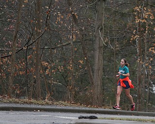 A woman runs past Laterman's Mill, Thursday, Jan. 11, 2018, in Mill Creek Park. ..(Nikos Frazier | The Vindicator)