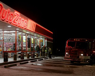 Youngstown Fire Department responds to a vehicle fire, Friday, Jan. 12, 2018, at the AutoZone on Youngstown-Poland Rd. in Youngstown. The Chevy Trailblazer reportedly caught fire after striking a pot hole. The driver was uninjured and pulled into the AutoZone parking lot before calling emergency services...(Nikos Frazier | The Vindicator)