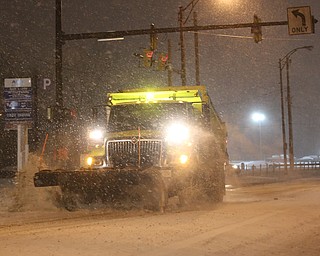 A City of Youngstown snow plow drives eastbound on Front St., Friday, Jan. 12, 2018, in Youngstown...(Nikos Frazier | The Vindicator)