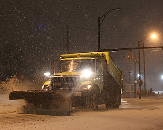 A City of Youngstown snow plow drives eastbound on Front St., Friday, Jan. 12, 2018, in Youngstown...(Nikos Frazier | The Vindicator)