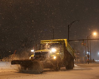 A City of Youngstown snow plow drives eastbound on Front St., Friday, Jan. 12, 2018, in Youngstown...(Nikos Frazier | The Vindicator)