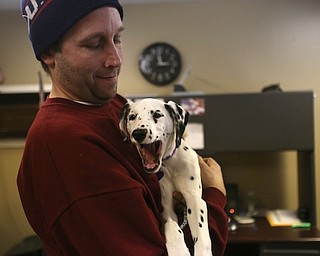 Firefighter Fred Behnke holds Daisy, Friday, Jan. 26, 2018, at the Eagle Joint Fire District in Hubbard...(Nikos Frazier | The Vindicator)