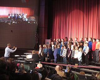 Neighbors | Zack Shively.Boardman schools celebrated their 100th anniversay with a special event centered around their arts program on Jan. 20 at the high school. Pictured, a choir consisting of students from the four elementary schools performed under the direction of Robert Pavalko.