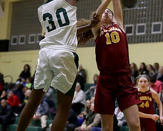 Ursuline's Anyah Curd (30) spikes the ball out of Cardinal Mooney Carolyn Kay (10)s hands as Kay was going up for a layup in the first quarter of an OSHAA basketball game, Thursday, Feb. 1, 2018, in Youngstown. Ursuline won 76-54...(Nikos Frazier | The Vindicator)