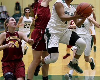 Ursuline's Dayshonette Harris (1) goes up for a layup as Cardinal Mooney Kelly Williams (24) attempts to block her shot in the second quarter of an OSHAA basketball game, Thursday, Feb. 1, 2018, in Youngstown. Ursuline won 76-54...(Nikos Frazier | The Vindicator)