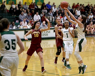 Ursuline's Cara McNally (5) goes up for three in the third quarter of an OSHAA basketball game, Thursday, Feb. 1, 2018, in Youngstown. Ursuline won 76-54...(Nikos Frazier | The Vindicator)