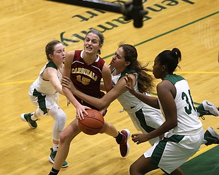 Cardinal Mooney Lauren Frommelt (15) is brought down under the net by Ursuline's Destiny Goodnight (24) in the fourth quarter of an OSHAA basketball game, Thursday, Feb. 1, 2018, in Youngstown. Ursuline won 76-54...(Nikos Frazier | The Vindicator)