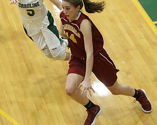 Cardinal Mooney Camden Hergenrather (14) charges to the net with Ursuline's Cara McNally (5) on her tail in the fourth quarter of an OSHAA basketball game, Thursday, Feb. 1, 2018, in Youngstown. Ursuline won 76-54...(Nikos Frazier | The Vindicator)