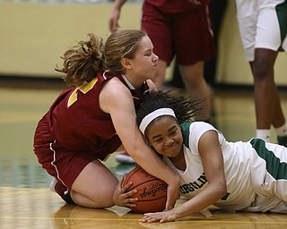 Ursuline's Dayshonette Harris (1) and Cardinal Mooney CJ Sapp (32) fight for the ball in the fourth quarter of an OSHAA basketball game, Thursday, Feb. 1, 2018, in Youngstown. Ursuline won 76-54...(Nikos Frazier | The Vindicator)