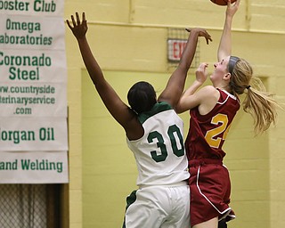 Cardinal Mooney Kelly Williams (24) goes up for a layup over Ursuline's Anyah Curd (30) in the fourth quarter of an OSHAA basketball game, Thursday, Feb. 1, 2018, in Youngstown. Ursuline won 76-54...(Nikos Frazier | The Vindicator)