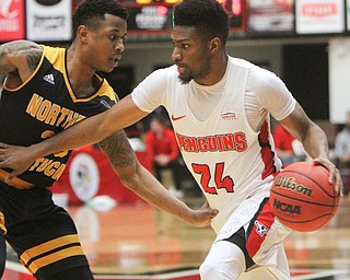 WilliamD. Lewis The Vindicator YSU's Cam Morse(24) drives around NKU's Lavonne Holland(30) during 2-1-18 action at YSU.