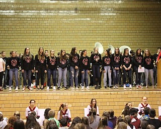 Neighbors | Abby Slanker.Canfield Village Middle School eighth-grade girls basketball coach Jim Harmon (right) spoke about his undefeated team at the school’s annual Winter Sports Pep Assembly.