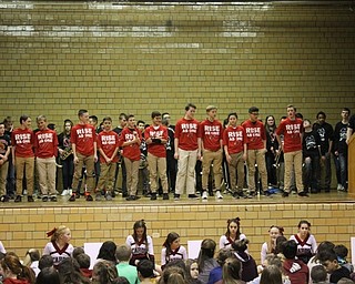 Neighbors | Abby Slanker.Canfield Village Middle School seventh-grade boys basketball coach Brady Clark (right) introduced his team at the assembly on Jan. 26.