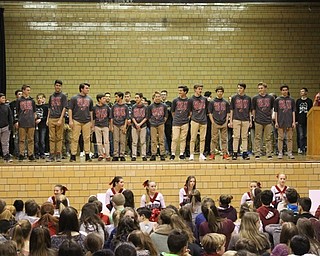 Neighbors | Abby Slanker.Canfield Village Middle School eighth-grade boys basketball coach Mike Yourstowsky (right) introduced his team at the school’s annual Winter Sports Pep Assembly on Jan. 26.