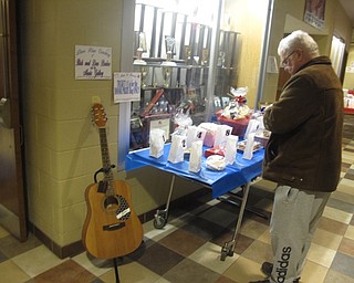 Neighbors | Zack Shively.The Jazz and Dessert night featured a Chinese auction as well as music and sweets. The auction prizes included treats from the bakers at the event as well as an acoustic guitar donated for the event.