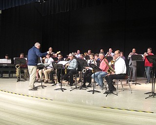 Neighbors | Zack Shively.Austintown Fitch principal Marc Pupino directed the alumni band, which featured graduates from the 70s to recent graduates. Along with Pupino, Austintown choir teacher and drama instructor Bill Klein and band parent president Brad Gessner performed in the band.