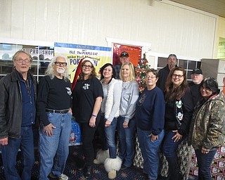 Neighbors | Zack Shively.The Mike Hull Mini Grant Review Committee awarded gifts to six families with autistic children on Dec. 19 at Mahoning Valley Lanes. They also had free bowling and pizza for the families. Pictured are the members of the committee, from left, (front) Jerry Marshall, Joe Kalamann, Melissa Kalamann, Maureen Richendollar, Nancy Hull, Mary Kay Johnson, Bertie Morrissey, Raylenne Rose; (back) John Morrissey, Art Rose and Paul Frondorf. Not pictured are Angelo Hull and Tom Mechlin.