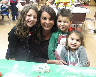 Neighbors | Zack Shively.Families came to Boardman Park to make cookies for Santa on Dec. 20. Pictured are, from left, Ava, Toni, Mia and Mason Acevedio. They rolled out dough and chaped their cookies.