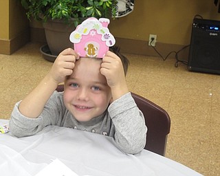 Neighbors | Zack Shively.The park provided children with crafts during the "Cookies with Santa" event. The children decorated a gingerbread man and house. Pictured is Aiden Chizmar with the craft he made.