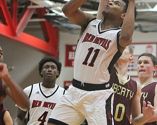 William D. Lewis The Vindicator Campbell's TraeEdwards(11) goes up for 2 against Liberty during 2-2-18 action at Campbell.