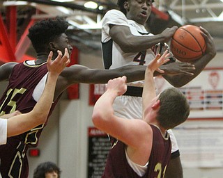 William D. Lewis The Vindicator Campbell's Eric Van Cobb(4) pulls down a rebound past Liberty's Ezell Brown(15) and David Sewell(21) during 2-2-18 action at Liberty.