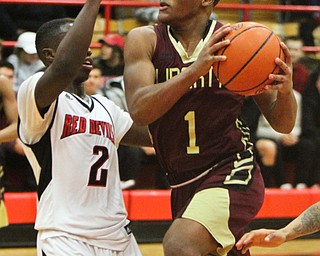 William D. Lewis The Vindicator Liberty's Dra Rushton(1) drives to the hoop as Campbell's Brandon Liggins(2) defends during 2-2-18 action at Campbell.
