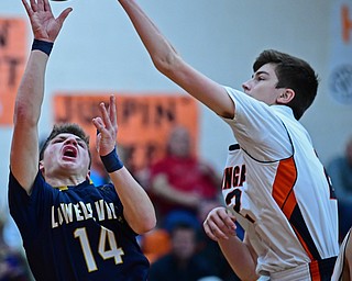 NEW MIDDLETOWN, OHIO - FEBRUARY 2, 2018: Springfield's Drew Clark blocks the shot from Lowellvile's Matt Hvisdak during the first half of their game on Friday night at Springfield High School. DAVID DERMER | THE VINDICATOR