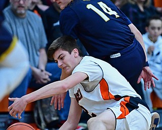 NEW MIDDLETOWN, OHIO - FEBRUARY 2, 2018: Springfield's Drew Clark reaches for the ball while being pressured by Lowellville's Matt Hvisdak during the first half of their game on Friday night at Springfield High School. DAVID DERMER | THE VINDICATOR