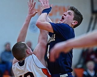 NEW MIDDLETOWN, OHIO - FEBRUARY 2, 2018: Lowellville's Matt Hvisdak loses control of the ball while going to the basket while being pressured by Springfield's John Ritter during the first half of their game on Friday night at Springfield High School. DAVID DERMER | THE VINDICATOR