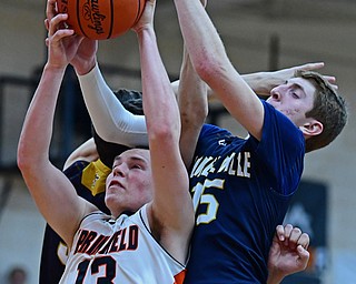 NEW MIDDLETOWN, OHIO - FEBRUARY 2, 2018: Springfield's John Ritter grabs a rebound away from Lowellville's Jake Rotz during the second half of their game on Friday night at Springfield High School. DAVID DERMER | THE VINDICATOR