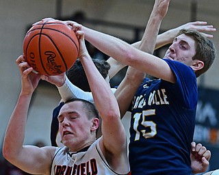 NEW MIDDLETOWN, OHIO - FEBRUARY 2, 2018: Springfield's John Ritter grabs a rebound away from Lowellville's Jake Rotz during the second half of their game on Friday night at Springfield High School. DAVID DERMER | THE VINDICATOR