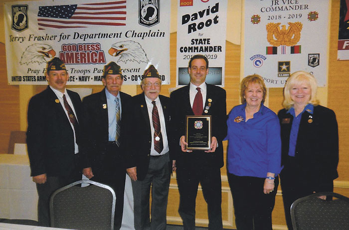 The Veterans of Foreign Wars Department of Ohio recently announced that Andrew Hake, a social studies teacher and football coach at Western Reserve Local Schools in Berlin Center, was the receipient of the 2018 Smart/Maher VFW National Citizenship Education Teacher award. Hake was selected from entries submitted to VFW posts across the state. VFW Meander Post 9571 and its Auxiliary in Ellsworth sponsored Hake, who will compete for the VFW Teacher of the Year award. Above, from left, are Joe Greene, VFW Department of Ohio community activities chairman; Roger Frye, VFW National chief of staff; Robert Giannone, VFW Department of Ohio commander; Hake; Darlene Beck, VFW Department of Ohio Auxiliary president; and Sandra Uzell, VFW Auxiliary National council member. Below, from left, are Jim Tornincasa, former VFW Ohio District 8 commander; Hake; and Ray Schafer, VFW Ohio District 8 junior vice commander and VFW Post 9571 quartermaster.
