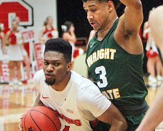 William D. Lewis The Vindicator YSU'sCam Morse(24) drives past WSU's Mark Hughes (3)during 2-3-18 action at YSU.