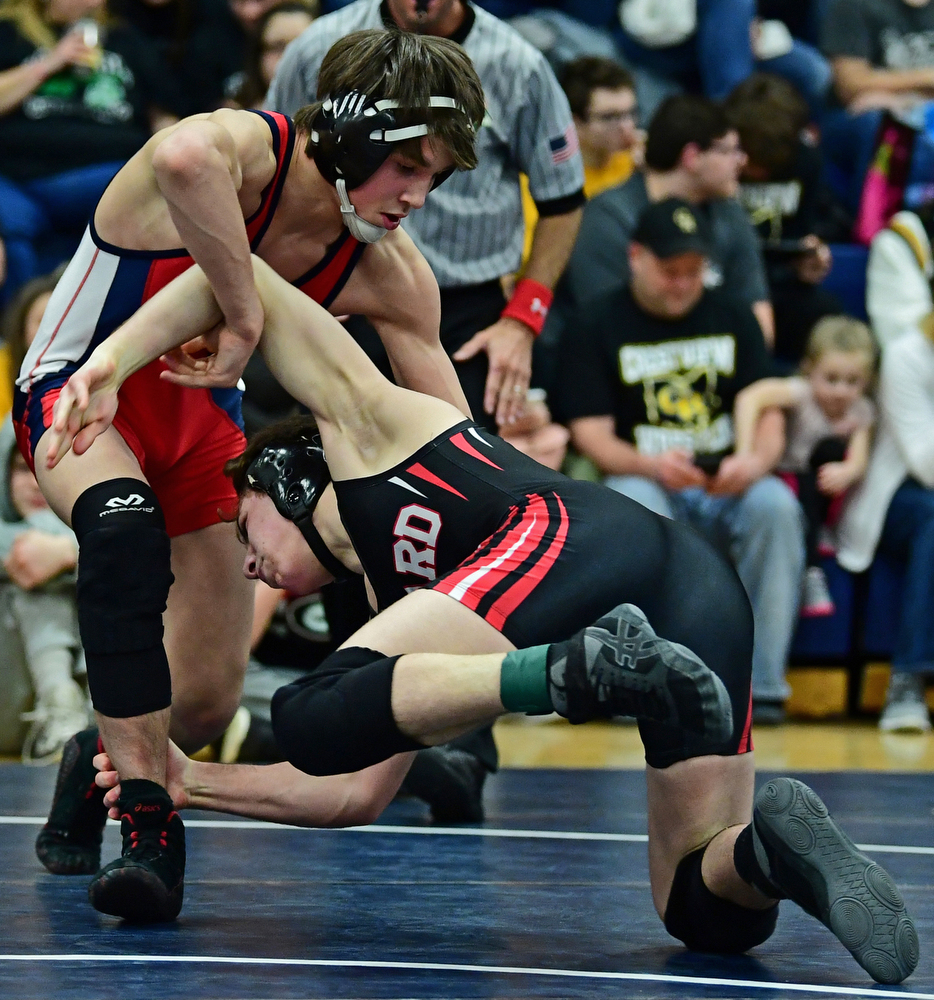 AUSTINTOWN, OHIO - FEBRUARY 3, 2018: Fitch's Gus Sutton stuffs a takedown attempt from Girard's Alex Delgarbino during their 126lb EOWL Championship bout, Saturday night at Austintown Fitch High School. DAVID DERMER | THE VINDICATOR